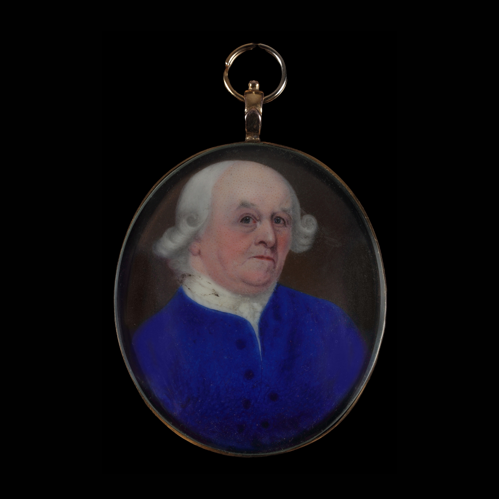 Portrait enamel of a Gentleman, wearing blue jacket with white stock and cravat, his wig powdered white